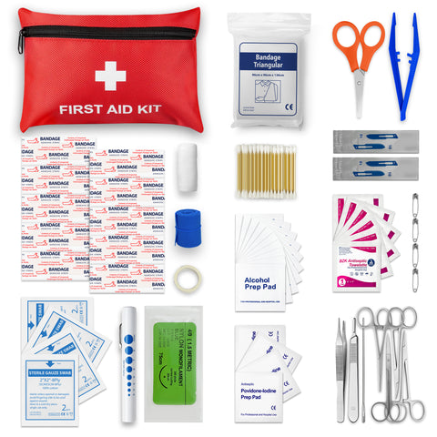 Flat lay of comprehensive First Aid Kit contents including red travel pouch, bandage scissors, hemostats, sterile gauze, sutures, penlight, and antiseptic supplies.
