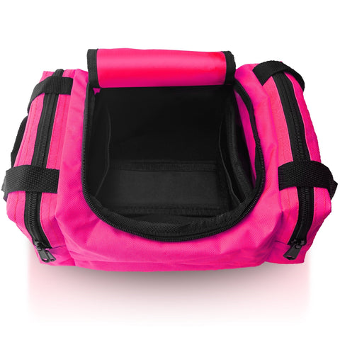 An overhead view of an empty, open pink first aid bag, revealing the black interior lining of the main compartment and the layout for storing medical supplies.