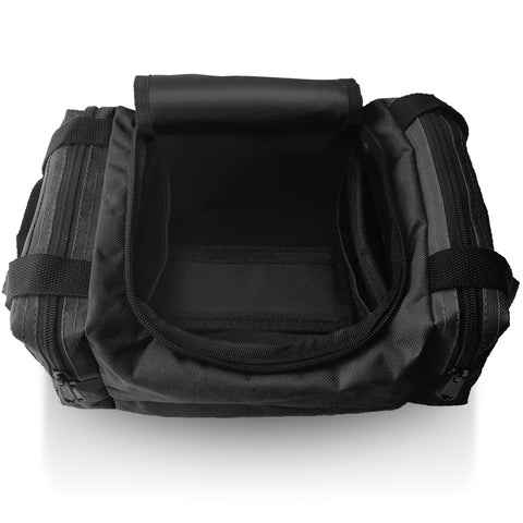 An overhead view of an empty, open black first aid bag, revealing the black interior lining of the main compartment and the layout for storing medical supplies.