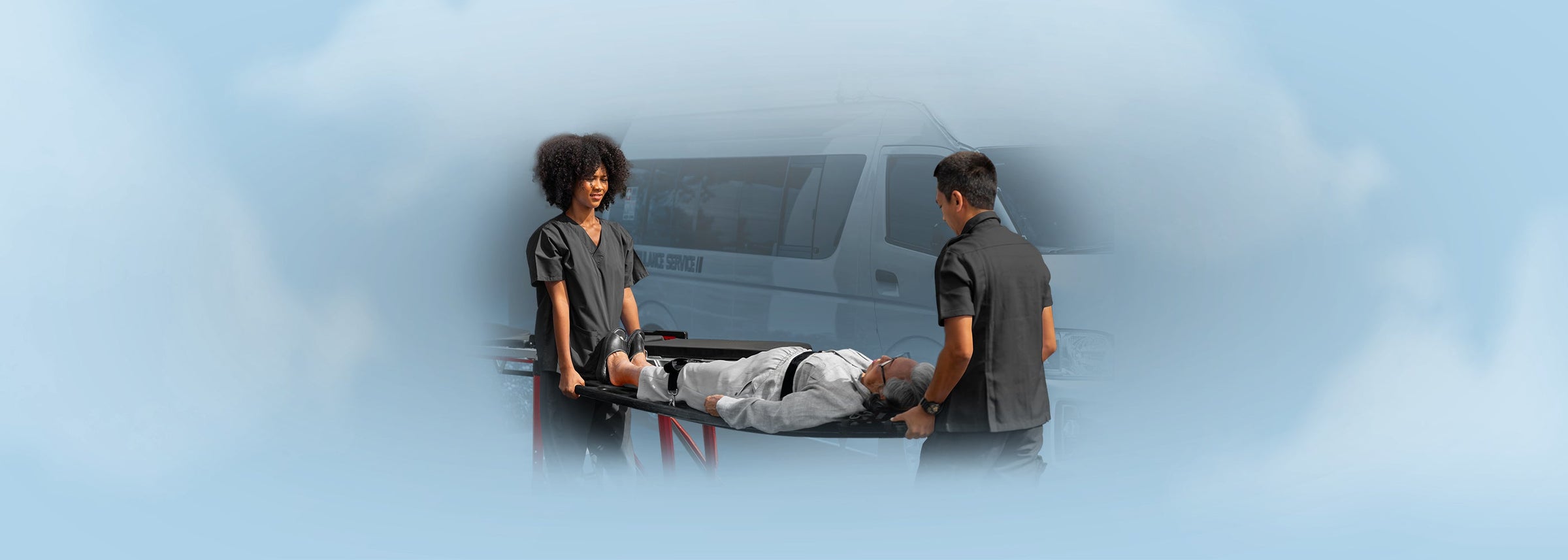 Emergency medical responders using a stretcher to transport a patient next to an ambulance, representing the Patient Transport & Immobilization collection
