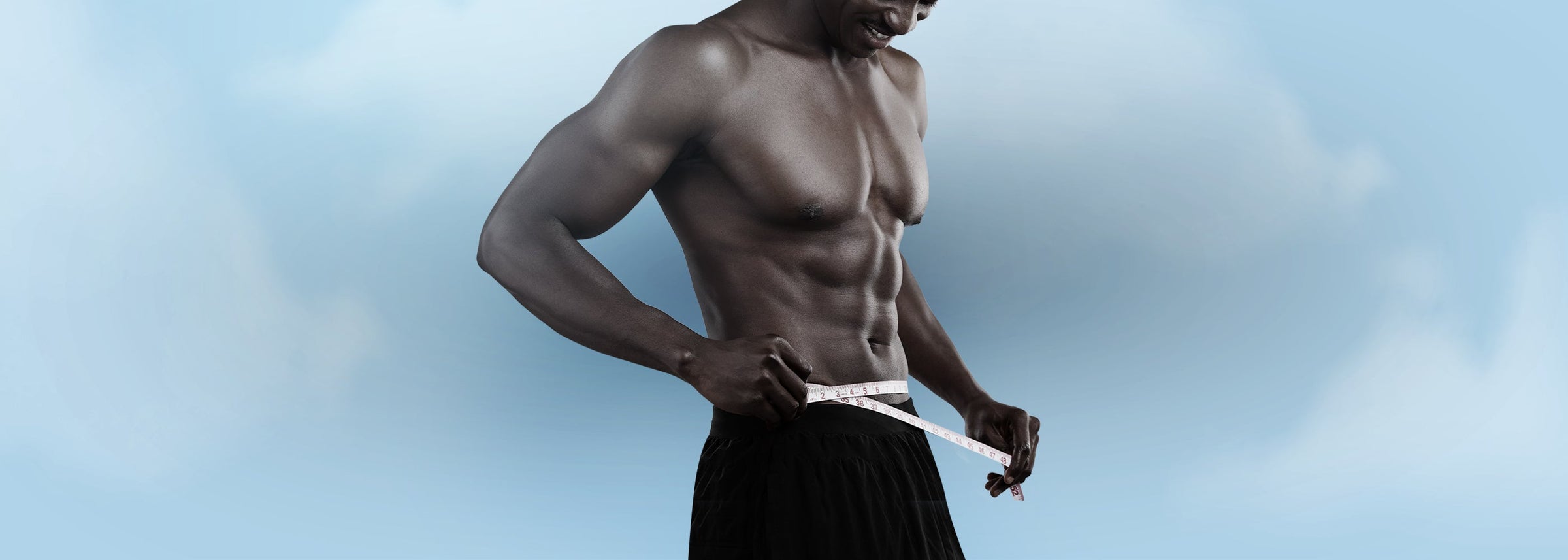 An athlete using a medical measuring tape to measure waist circumference, representing medical measurement and evaluation tools.