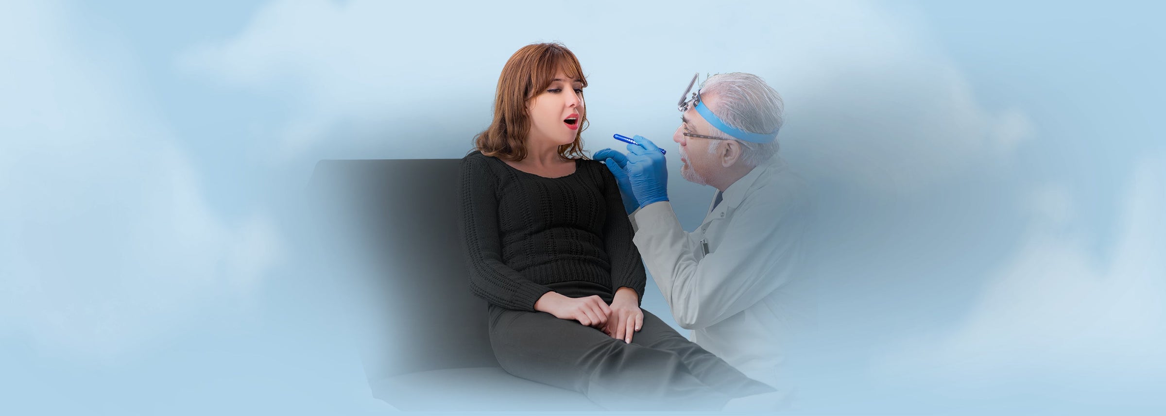 A senior doctor performing an oral exam on a patient using a professional medical penlight, representing medical penlights and tactical flashlights.