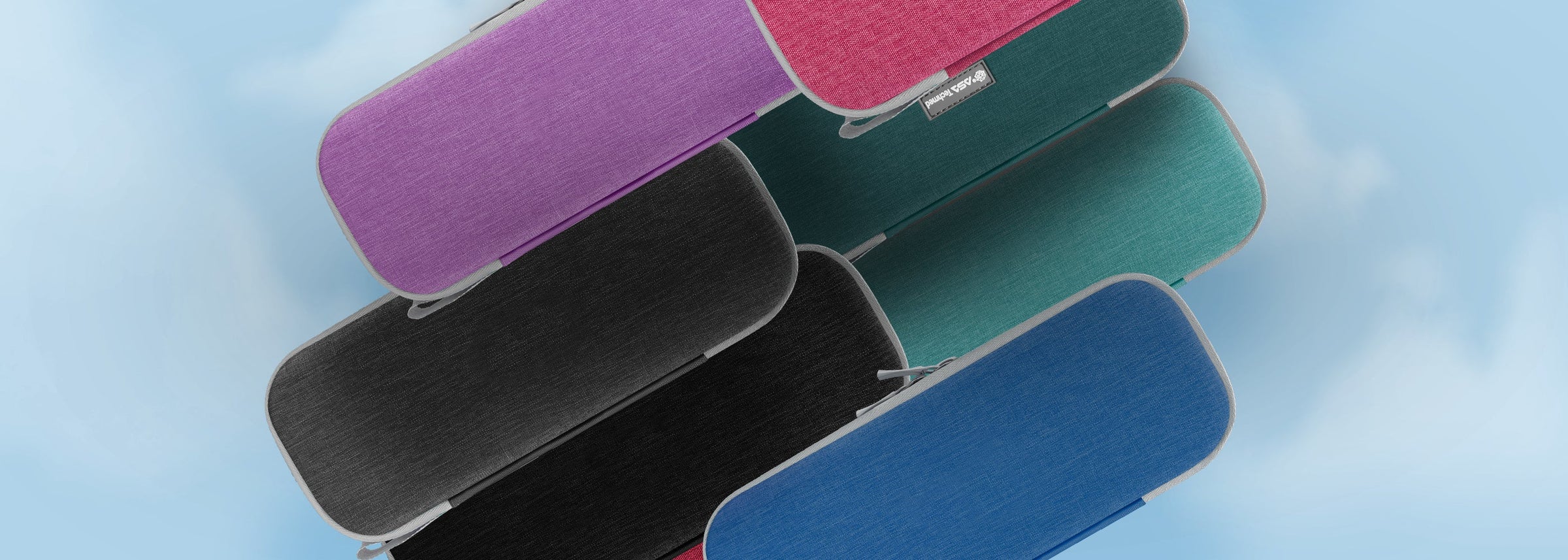 A variety of colorful, hard-shell stethoscope carrying cases in purple, pink, teal, blue, and black, representing the Stethoscope Cases & Carriers collection.