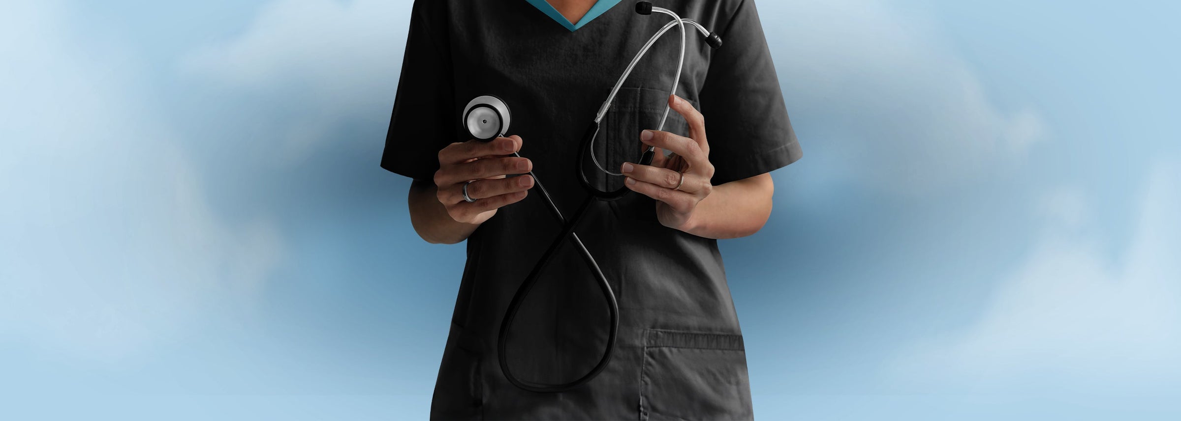 Close-up of a healthcare professional in grey scrubs holding a professional medical stethoscope from ASA Techmed