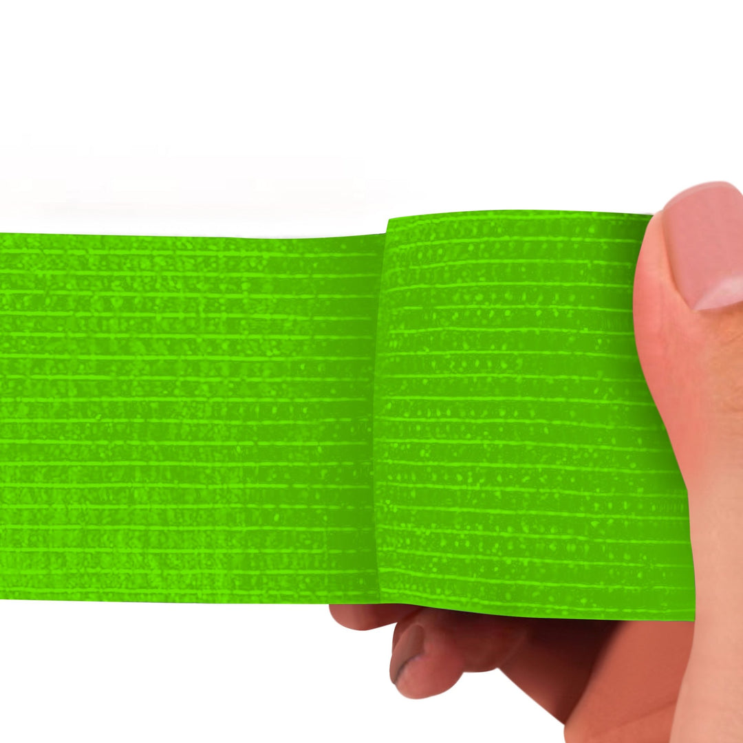 Light Green adhesive bandage wrap held by a hand on a white background