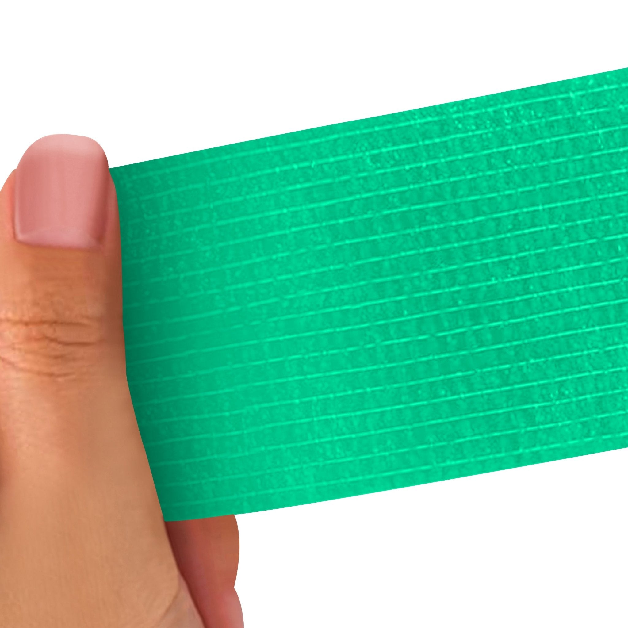 Hand holding a Turquoise strip of adhesive bandage wrap with a textured pattern on a white background