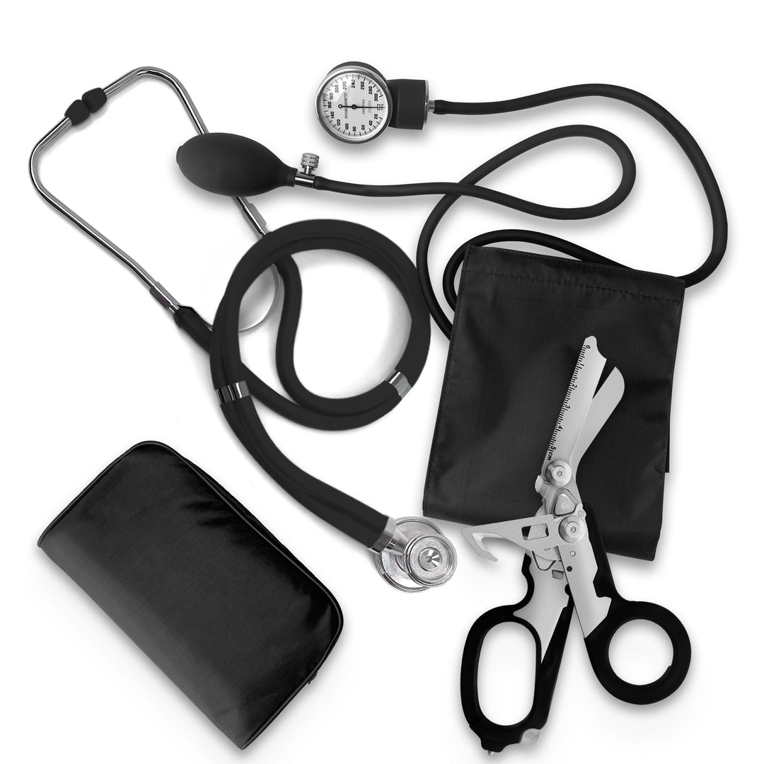 A casual flat lay arrangement of medical equipment showing a black blood pressure cuff with its gauge and bulb, a coiled black stethoscope, a black zippered carrying pouch, and unfolded trauma shears.
