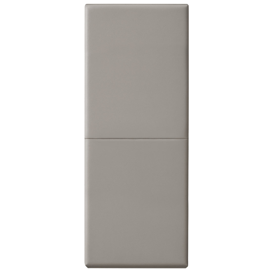 A vertical studio shot of a gray safety wall pad fully extended, showing the smooth vinyl texture and the horizontal crease in the center where the mat folds.