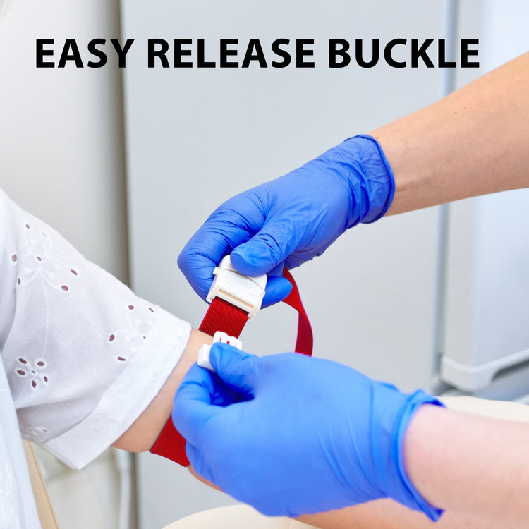 Close-up of hands in blue medical gloves demonstrating the easy-release buckle on a red tourniquet.