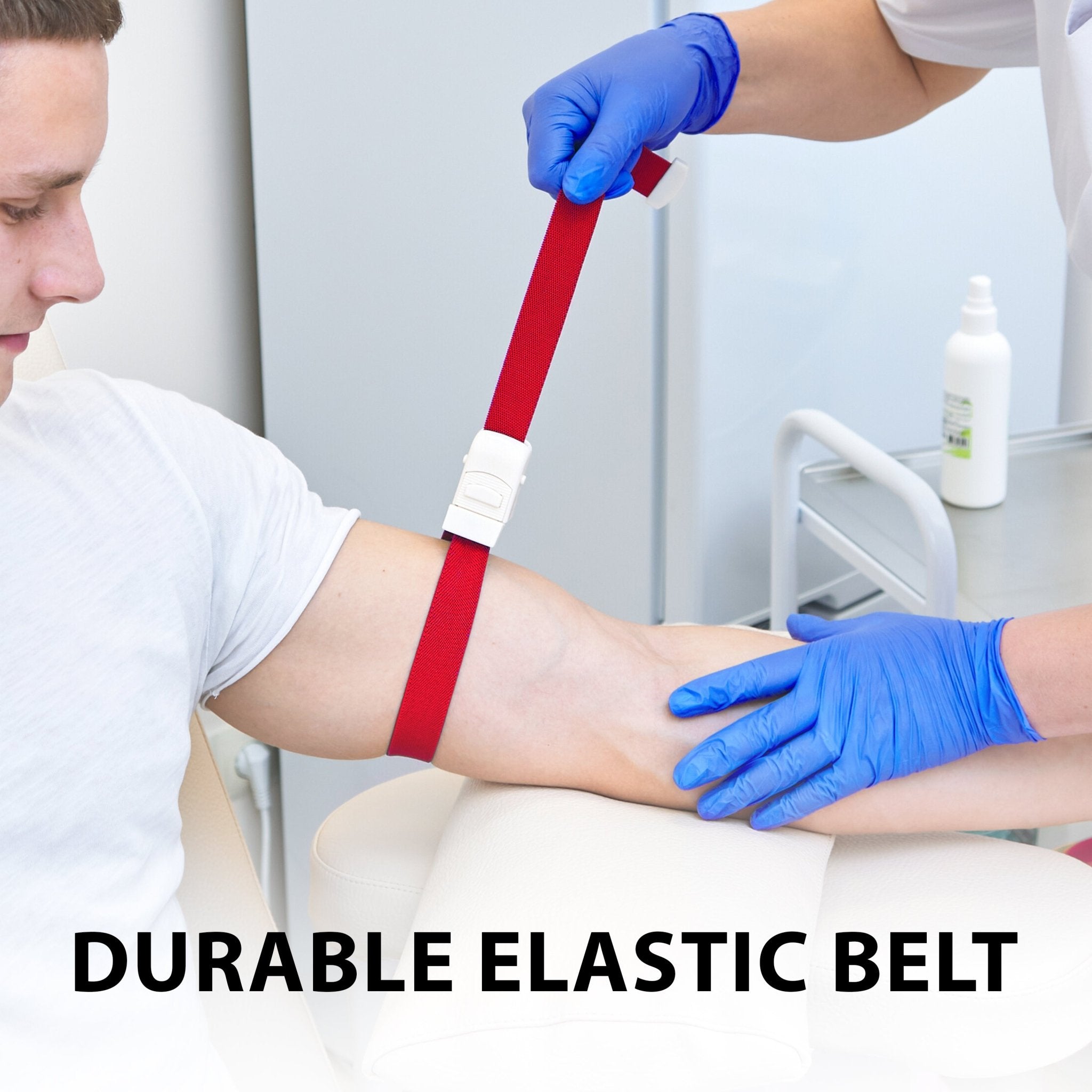A medical professional stretching a durable red elastic tourniquet belt on a patient's arm, labeled "DURABLE ELASTIC BELT".