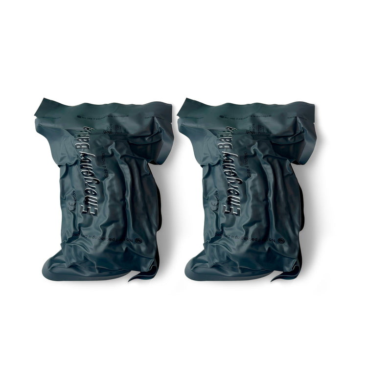 A pair of 4-inch Israeli style trauma bandages in protective vacuum-sealed gray packaging.