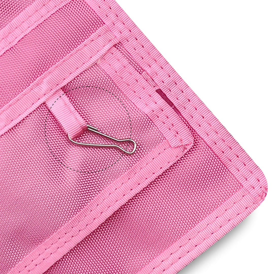 Close-up of a Light Pink fabric with a metal clip on a white background