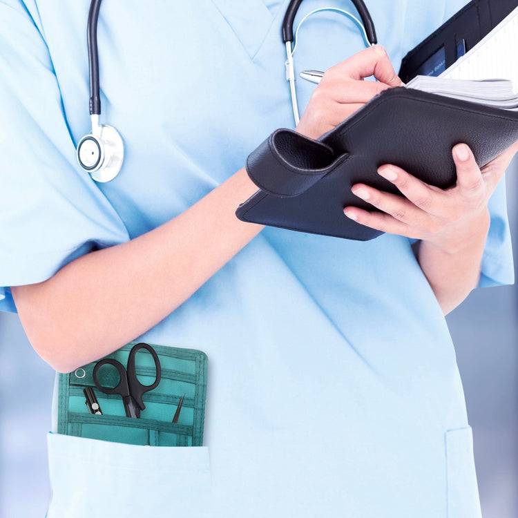 A nurse jotting down notes during her shift, with a sleek organizer pouch visibly tucked into her scrub pocket—ready with essential tools for quick access.
