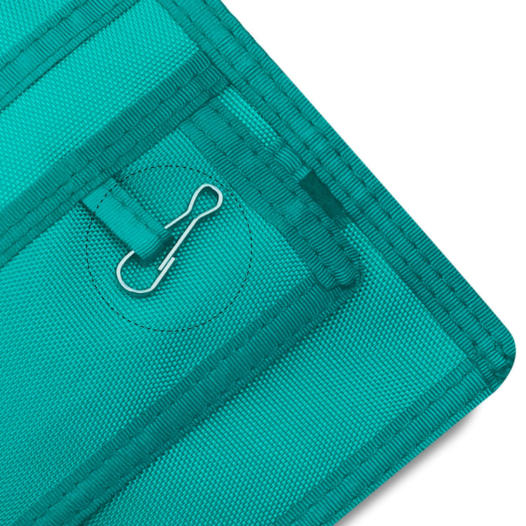 Close-up of a Green fabric with a metal clip on a white background