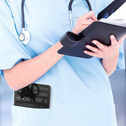 A nurse jotting down notes during her shift, with a sleek organizer pouch visibly tucked into her scrub pocket—ready with essential tools for quick access.