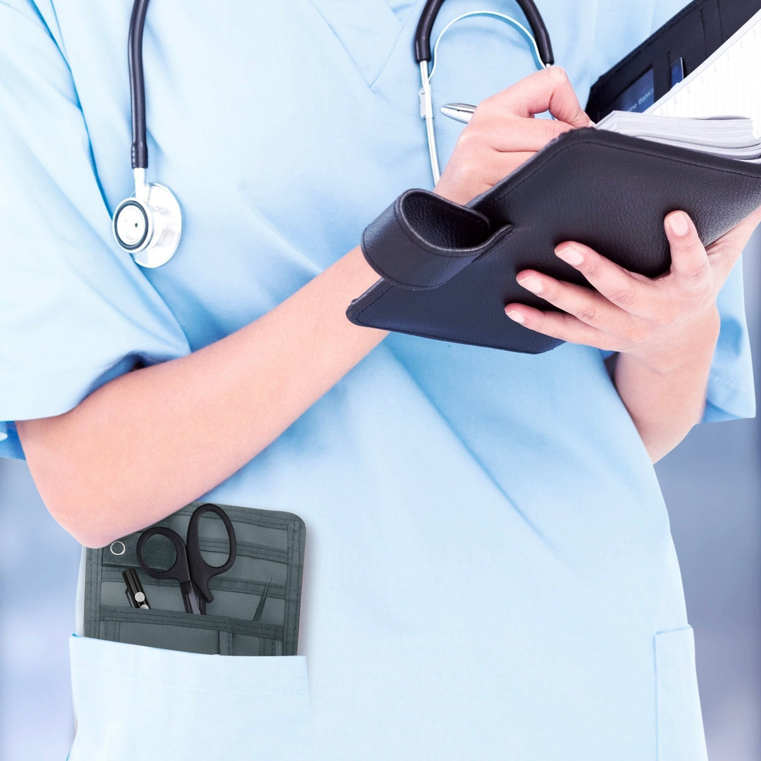 A nurse jotting down notes during her shift, with a sleek organizer pouch visibly tucked into her scrub pocket—ready with essential tools for quick access.