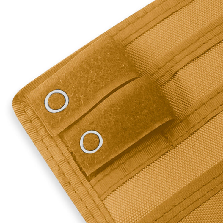 Close-up of a Yellow fabric with grommets on a white background