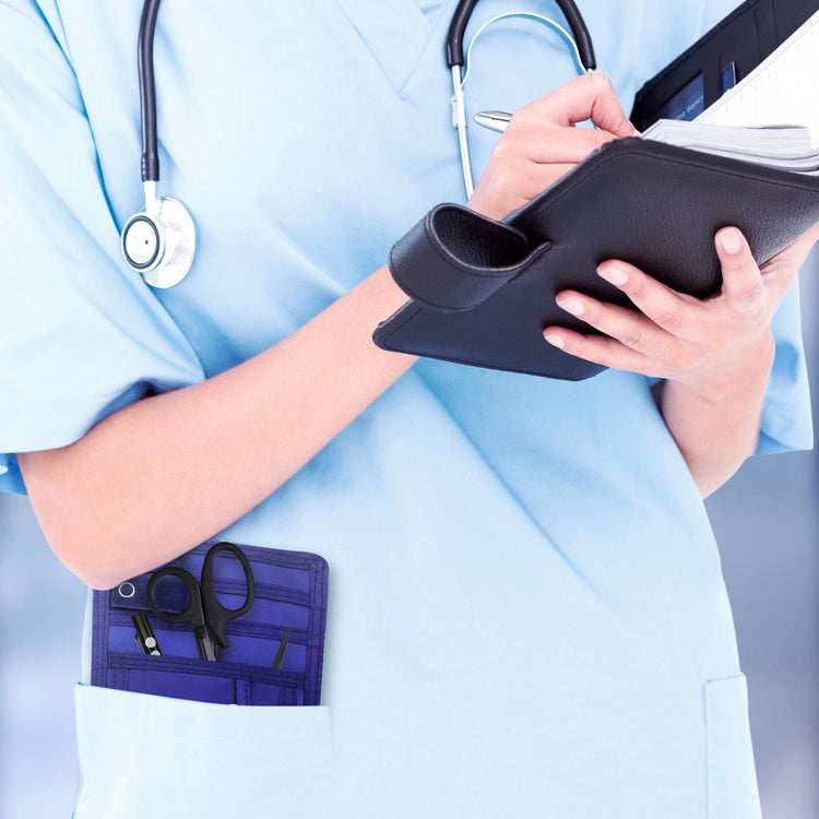 A nurse jotting down notes during her shift, with a sleek organizer pouch visibly tucked into her scrub pocket—ready with essential tools for quick access.