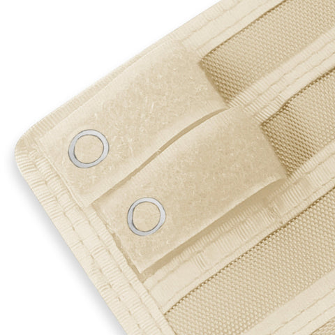 Close-up of a Off white fabric with grommets on a white background