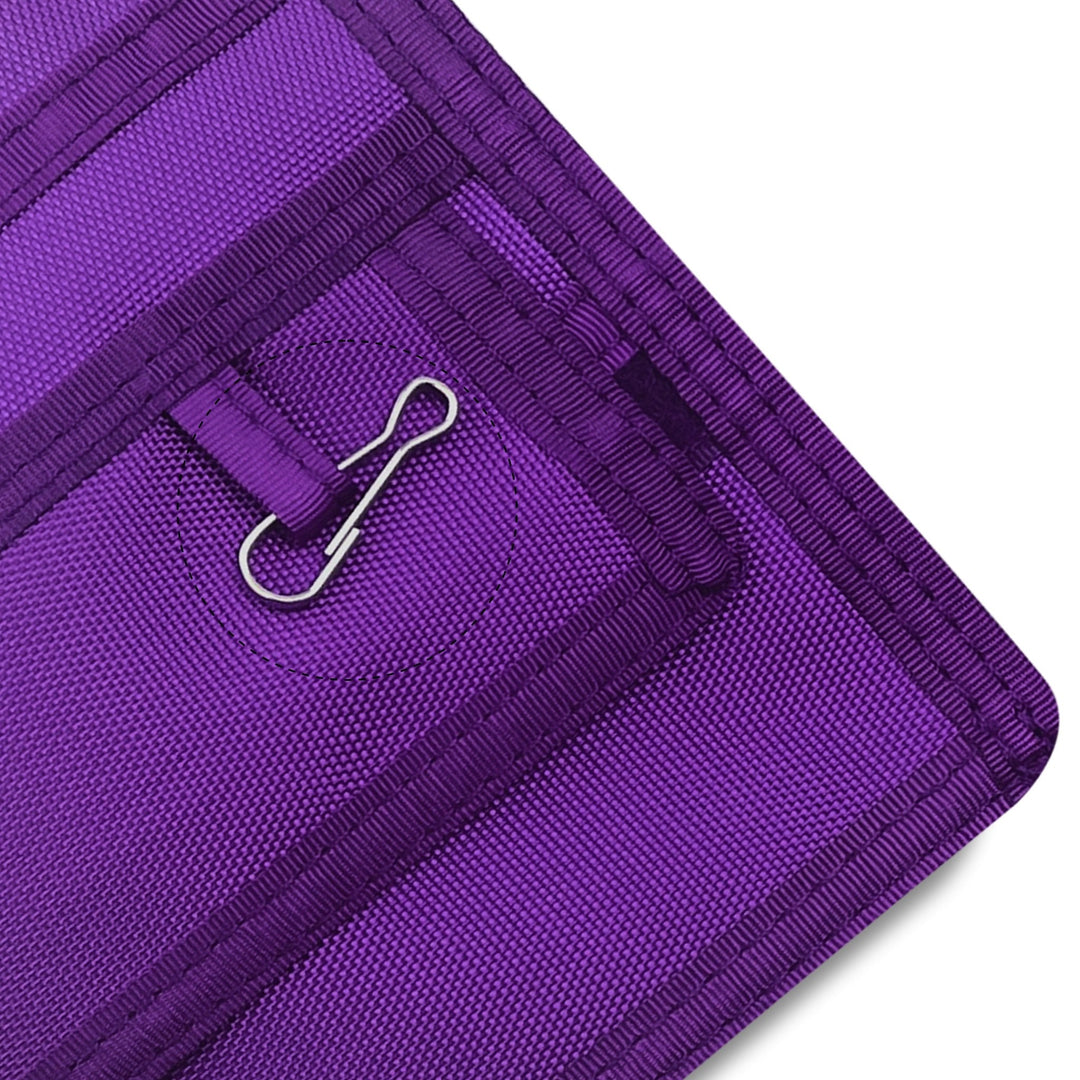 Close-up of a Purple fabric with a metal clip on a white background