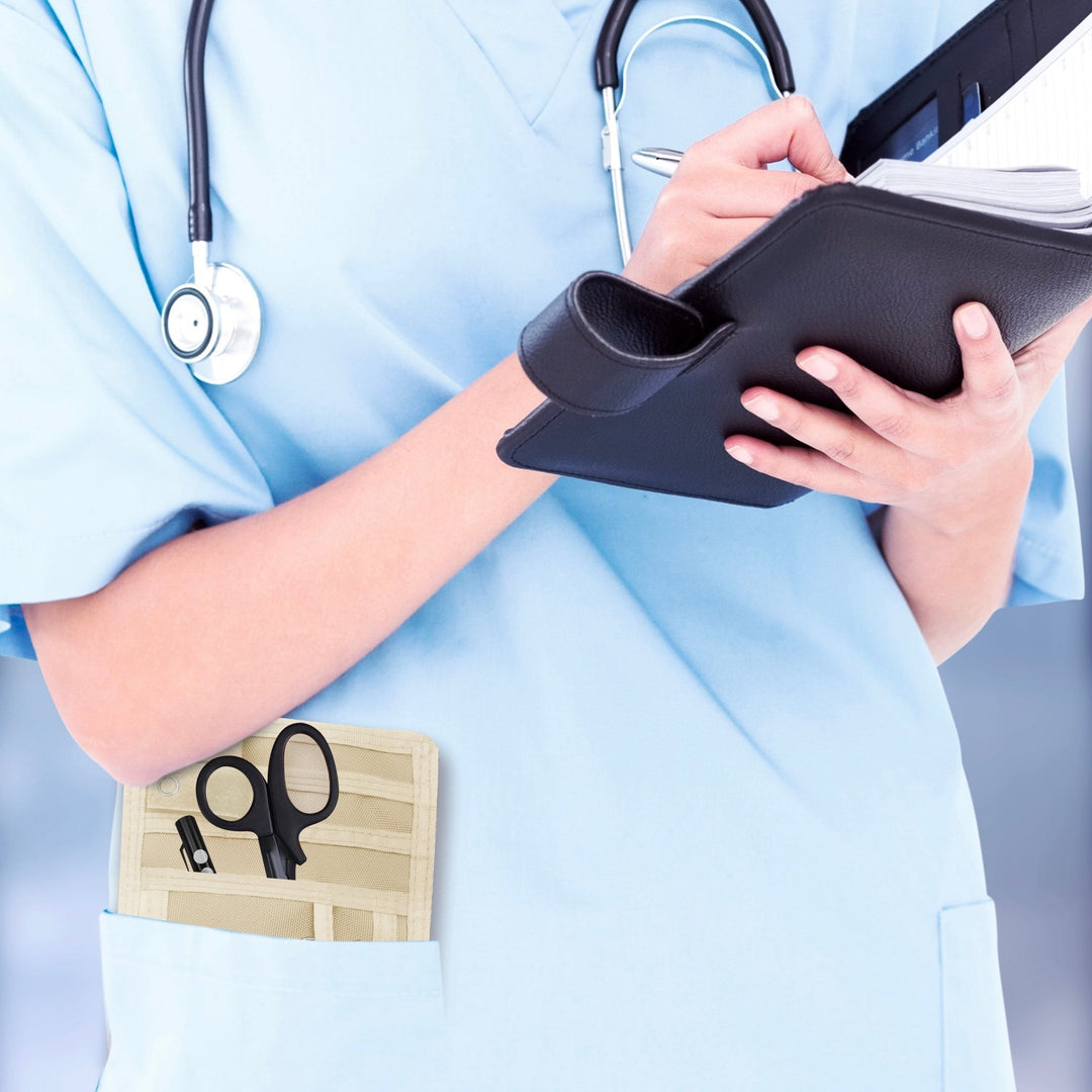 A nurse jotting down notes during her shift, with a sleek organizer pouch visibly tucked into her scrub pocket—ready with essential tools for quick access.