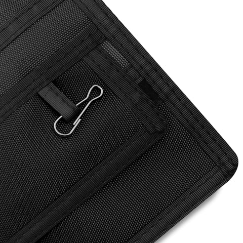 Close-up of a Black fabric with a metal clip on a white background