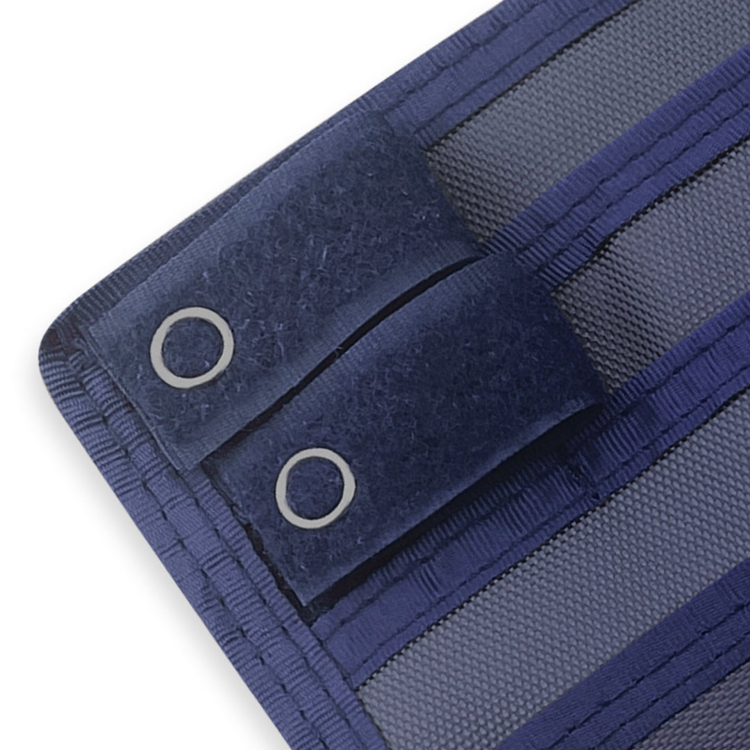 Close-up of a Navy Blue fabric with grommets on a white background
