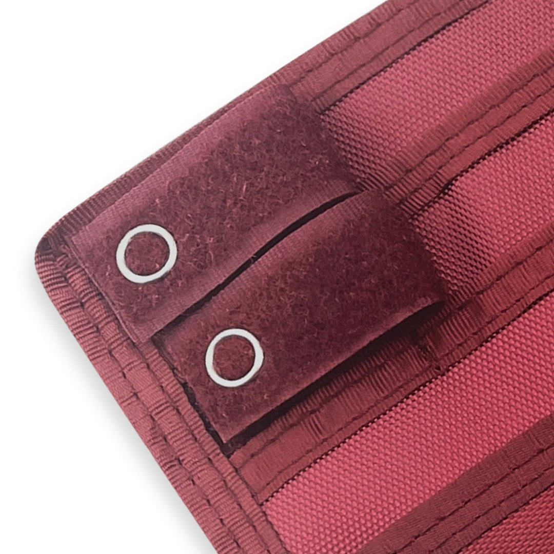 Close-up of a Burgundy fabric with grommets on a white background