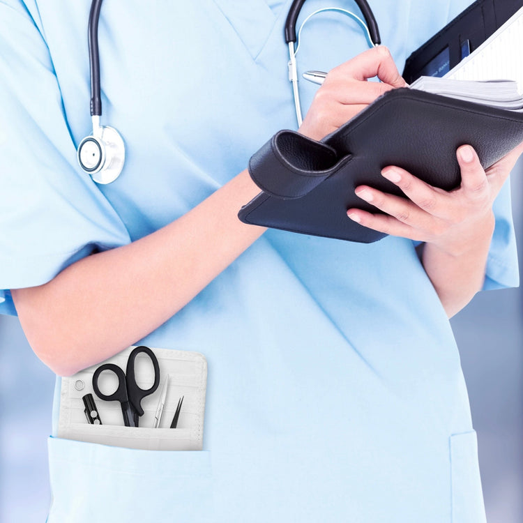 A nurse jotting down notes during her shift, with a sleek organizer pouch visibly tucked into her scrub pocket—ready with essential tools for quick access.
