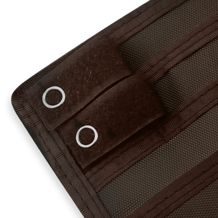 Close-up of a Brown fabric with grommets on a white background