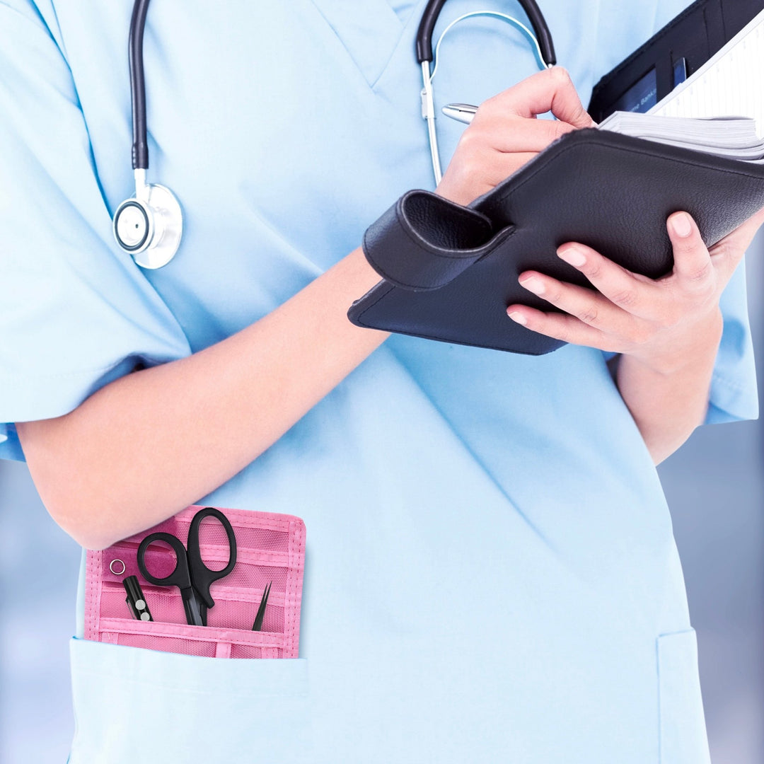 A nurse jotting down notes during her shift, with a sleek organizer pouch visibly tucked into her scrub pocket—ready with essential tools for quick access.