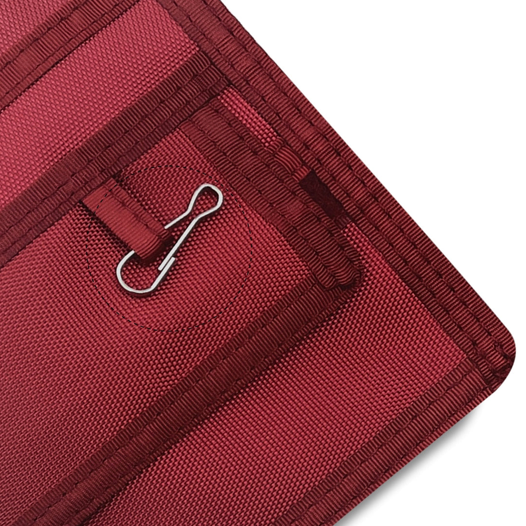 Close-up of a Burgundy fabric with a metal clip on a white background