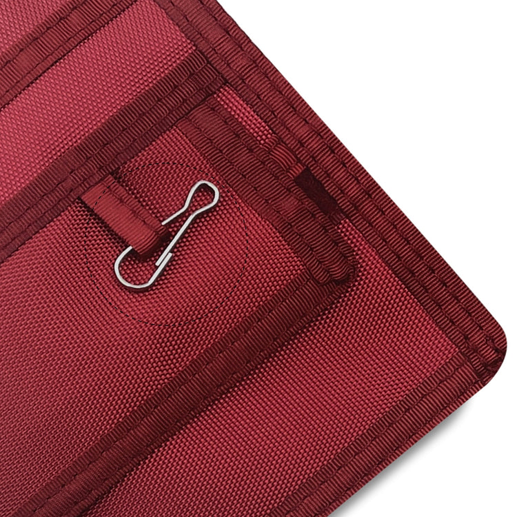 Close-up of a Burgundy fabric with a metal clip on a white background