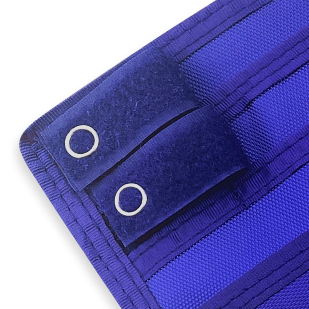 Close-up of a Blue fabric with grommets on a white background