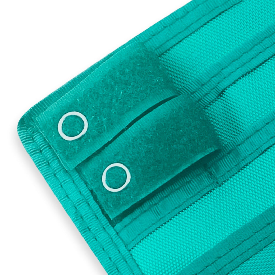 Close-up of a Green fabric with grommets on a white background