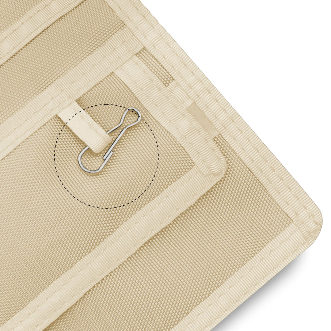 Close-up of a Off White fabric with a metal clip on a white background