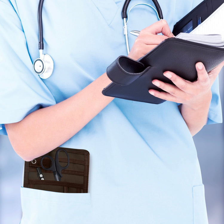 A nurse jotting down notes during her shift, with a sleek organizer pouch visibly tucked into her scrub pocket—ready with essential tools for quick access.