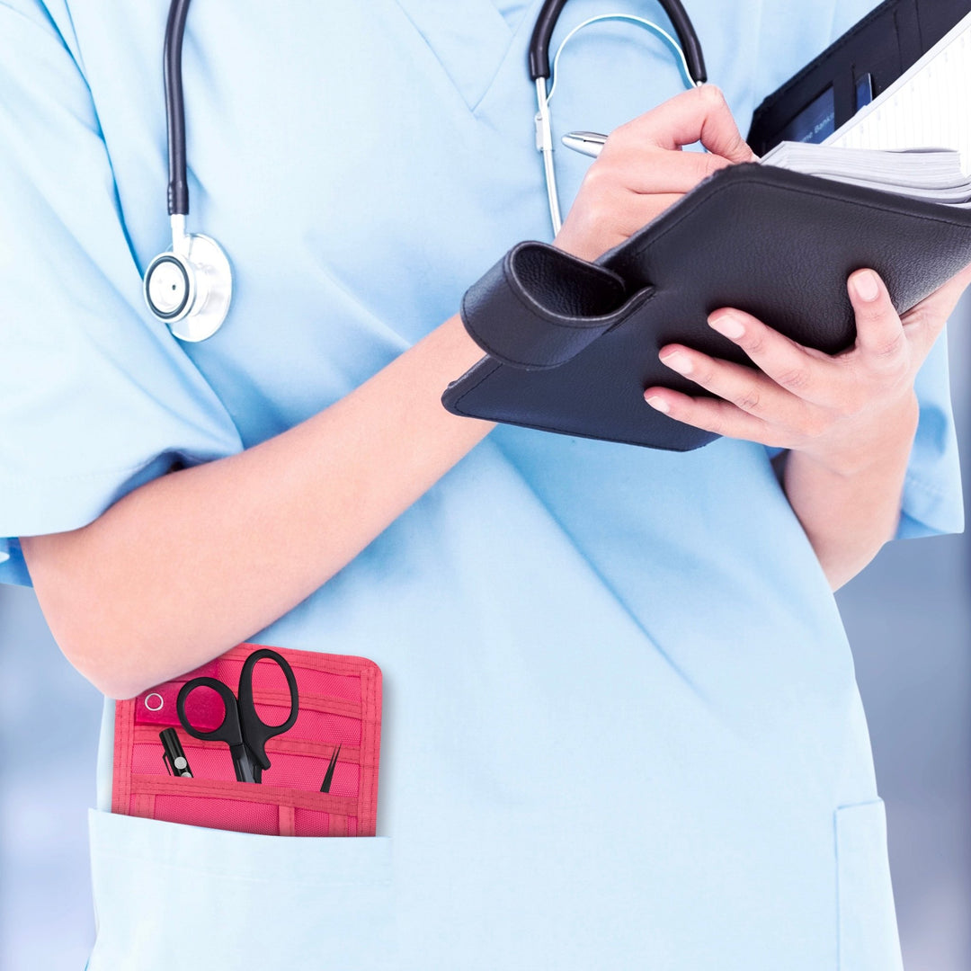 A nurse jotting down notes during her shift, with a sleek organizer pouch visibly tucked into her scrub pocket—ready with essential tools for quick access.