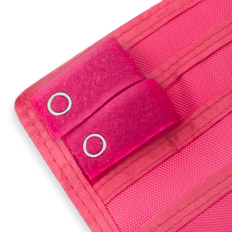 Close-up of a Hot Pink fabric with grommets on a white background