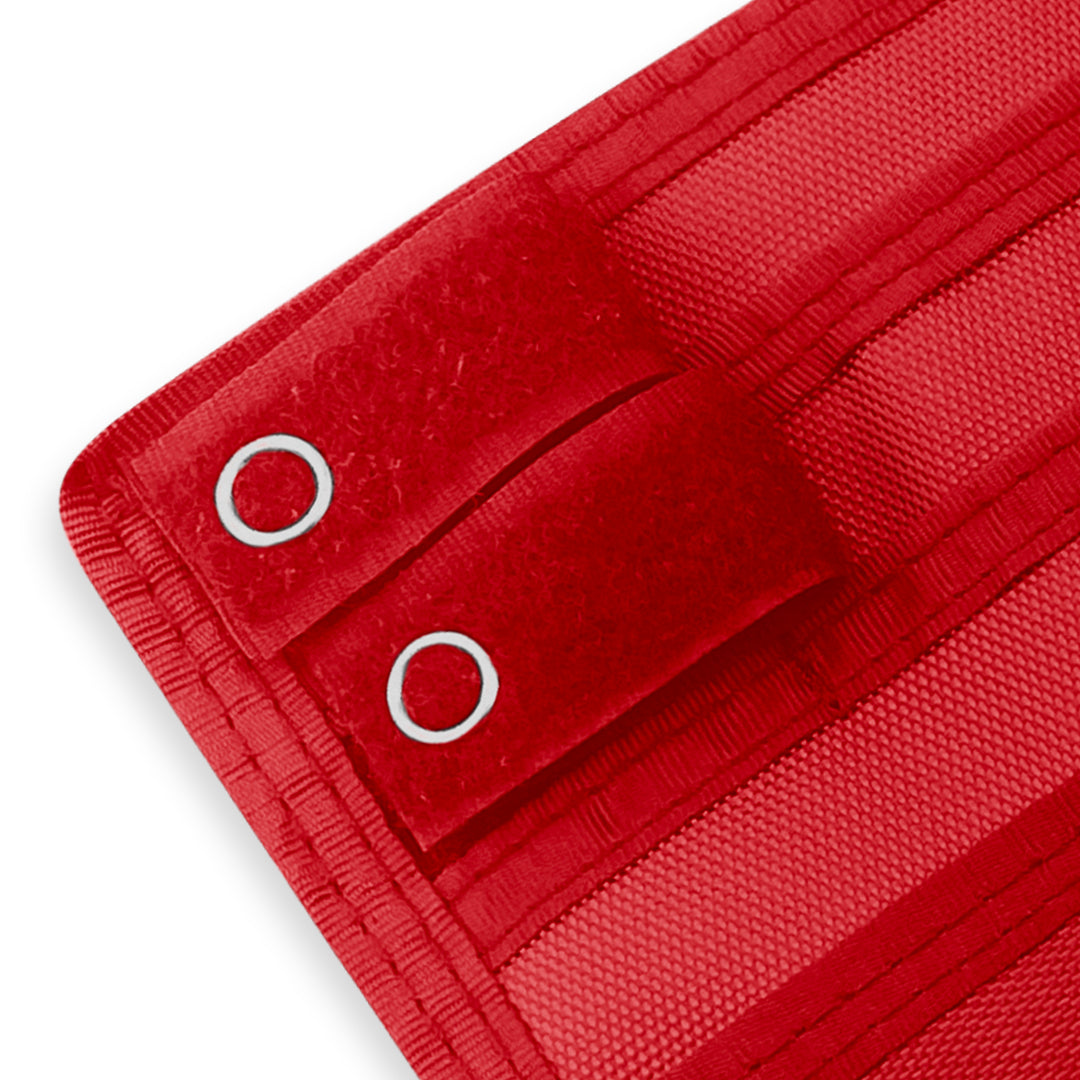 Close-up of a Red fabric with grommets on a white background