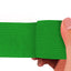 Green adhesive bandage wrap held by a hand on a white background