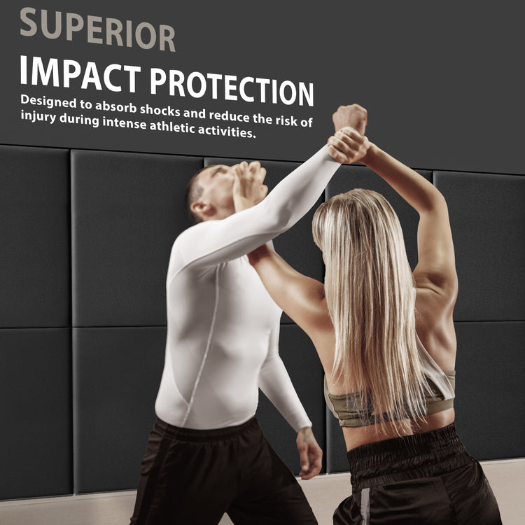 A man and woman practicing self-defense techniques against a wall lined with black pads, accompanied by text reading "SUPERIOR IMPACT PROTECTION" designed to reduce injury risk.
