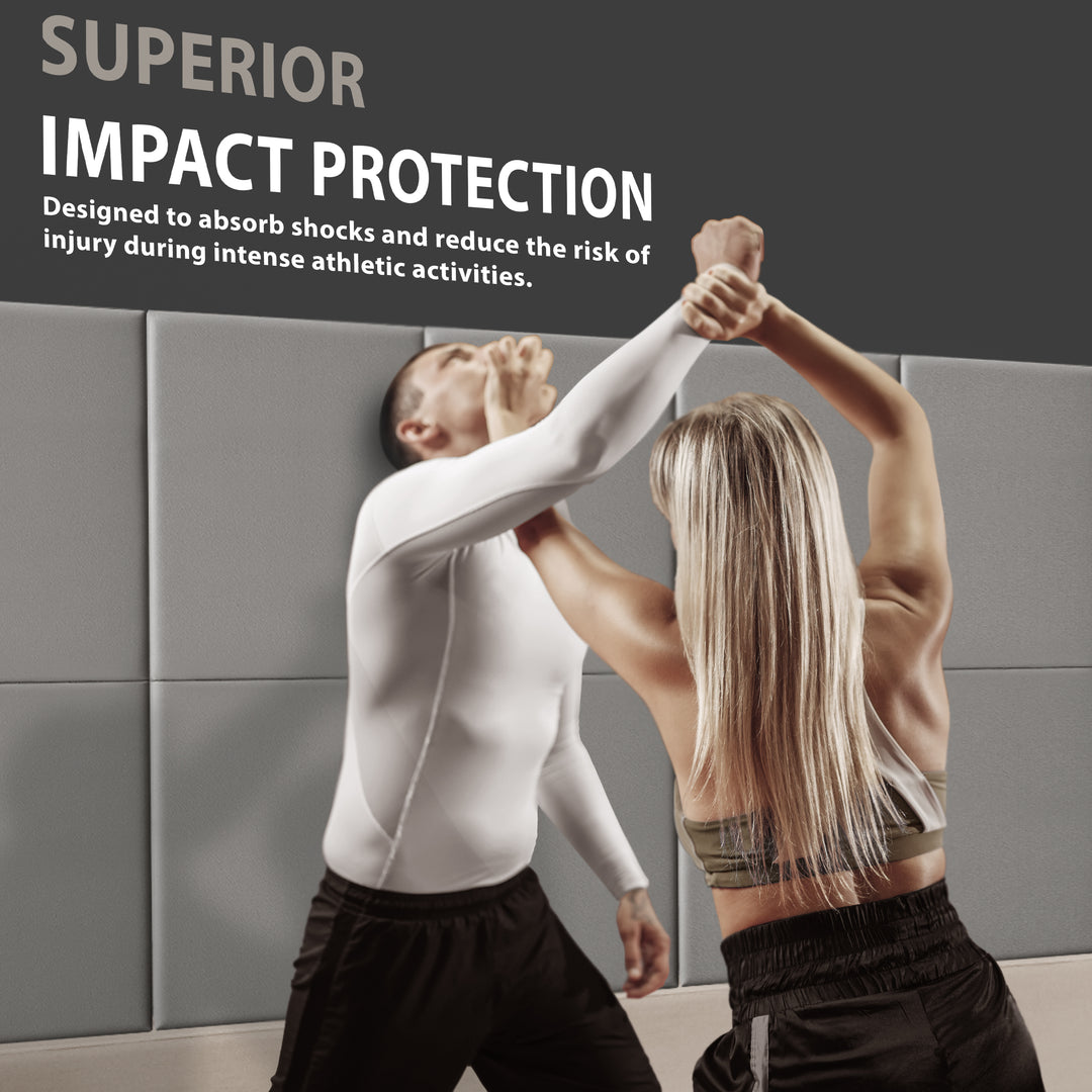 A man and woman practicing self-defense techniques against a wall lined with gray pads, accompanied by text reading "SUPERIOR IMPACT PROTECTION" designed to reduce injury risk.
