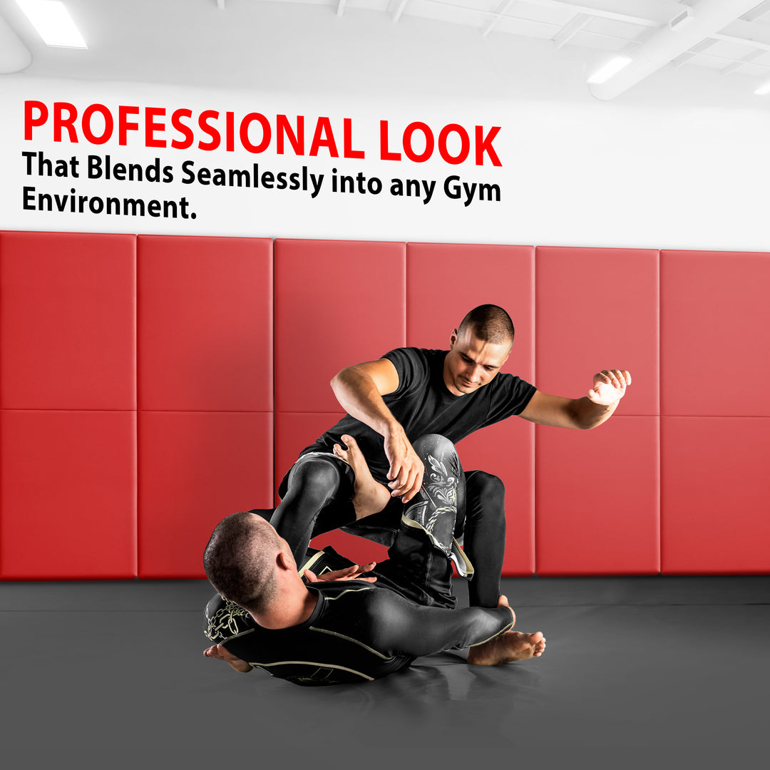 Two athletes grappling on a gym floor with the walls behind them covered in red protective padding, accompanied by text stating "PROFESSIONAL LOOK That Blends Seamlessly into any Gym Environment".