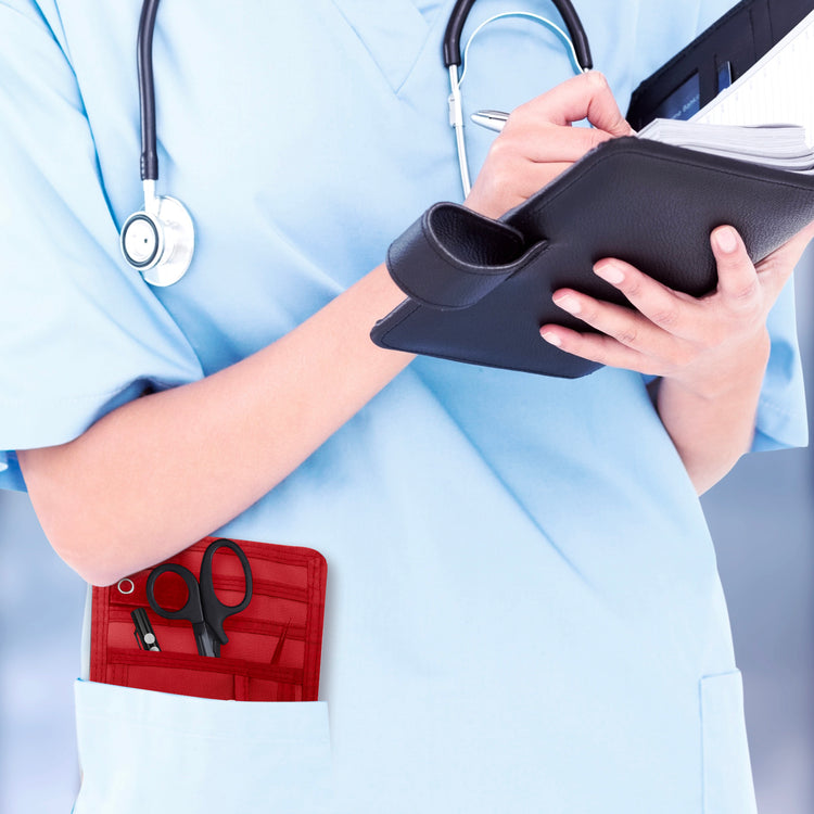 A nurse jotting down notes during her shift, with a sleek organizer pouch visibly tucked into her scrub pocket—ready with essential tools for quick access.