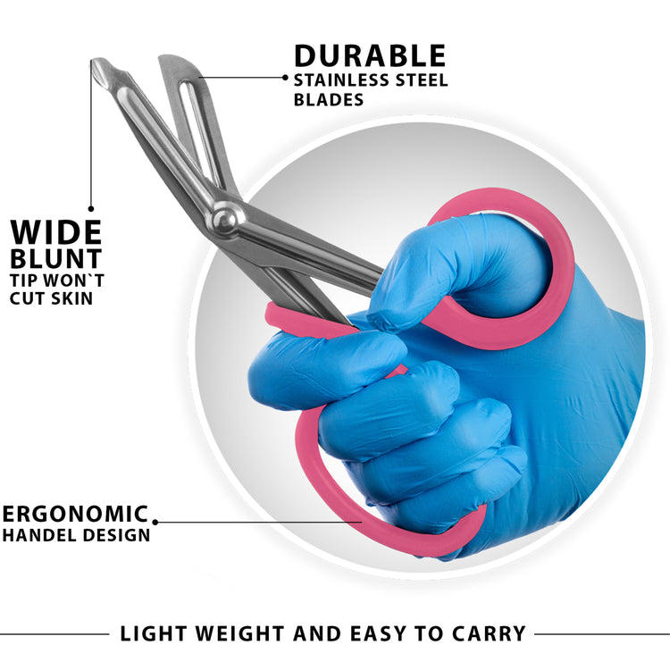 A graphic featuring a hand in a blue medical glove gripping a pair of trauma shears with bright pink handles. Lines point to specific features with descriptive text: the "wide blunt tip" that won't cut skin, the "durable stainless steel blades," and the "ergonomic handle design." Text across the bottom reads, "Light weight and easy to carry."