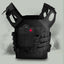 Black tactical vest with a red cross patch molle pouch on a light gray background