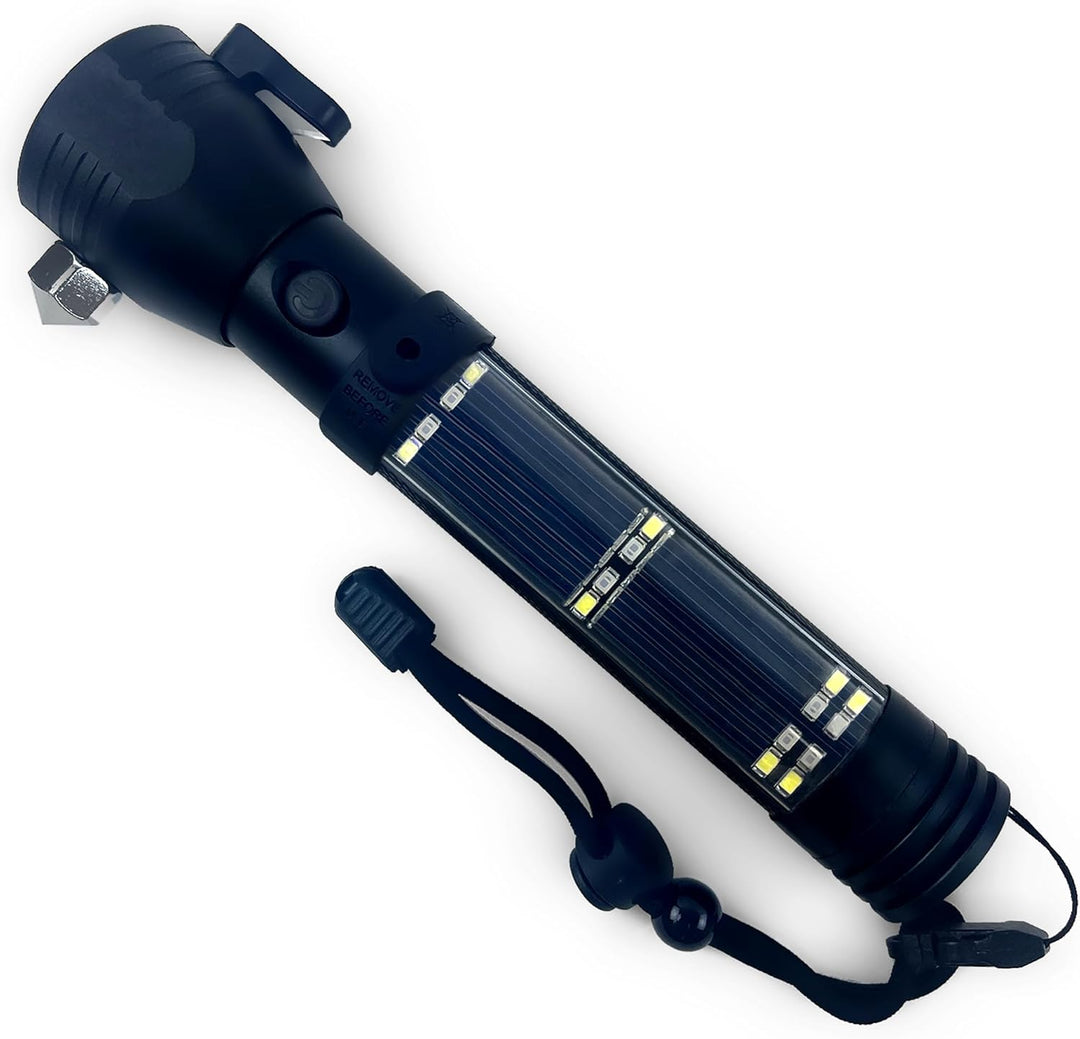 A black tactical flashlight, branded "ASA Techmed," featuring an integrated seat belt cutter (handle), a hexagonal metal glass-breaking hammer on the head, and a section of solar panels and white LED lights along the body. A black lanyard is attached to the base.