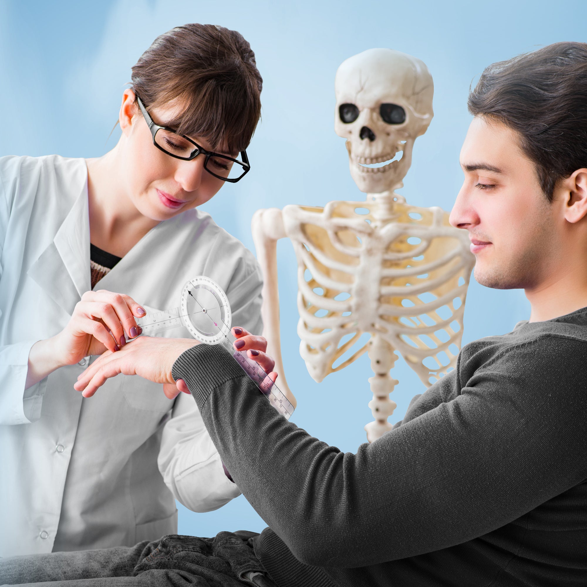 Female physical therapist using a goniometer to measure the range of motion of a male patient's wrist joint, demonstrating clinical use in a physical therapy or medical setting.