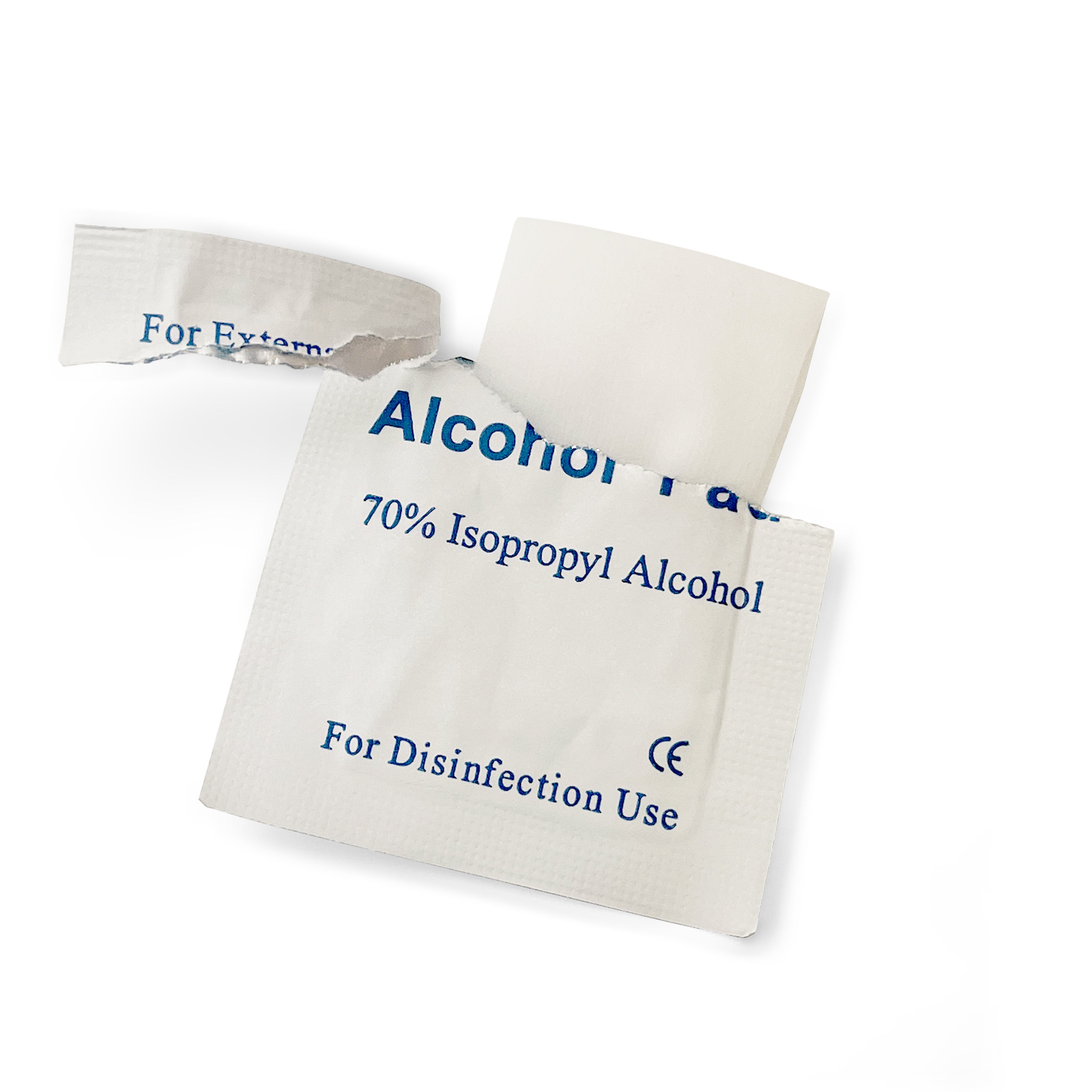A close-up of a white, torn-open packet labeled "Alcohol Pad" containing a 70% Isopropyl Alcohol wipe for disinfection, revealing the folded white pad inside.